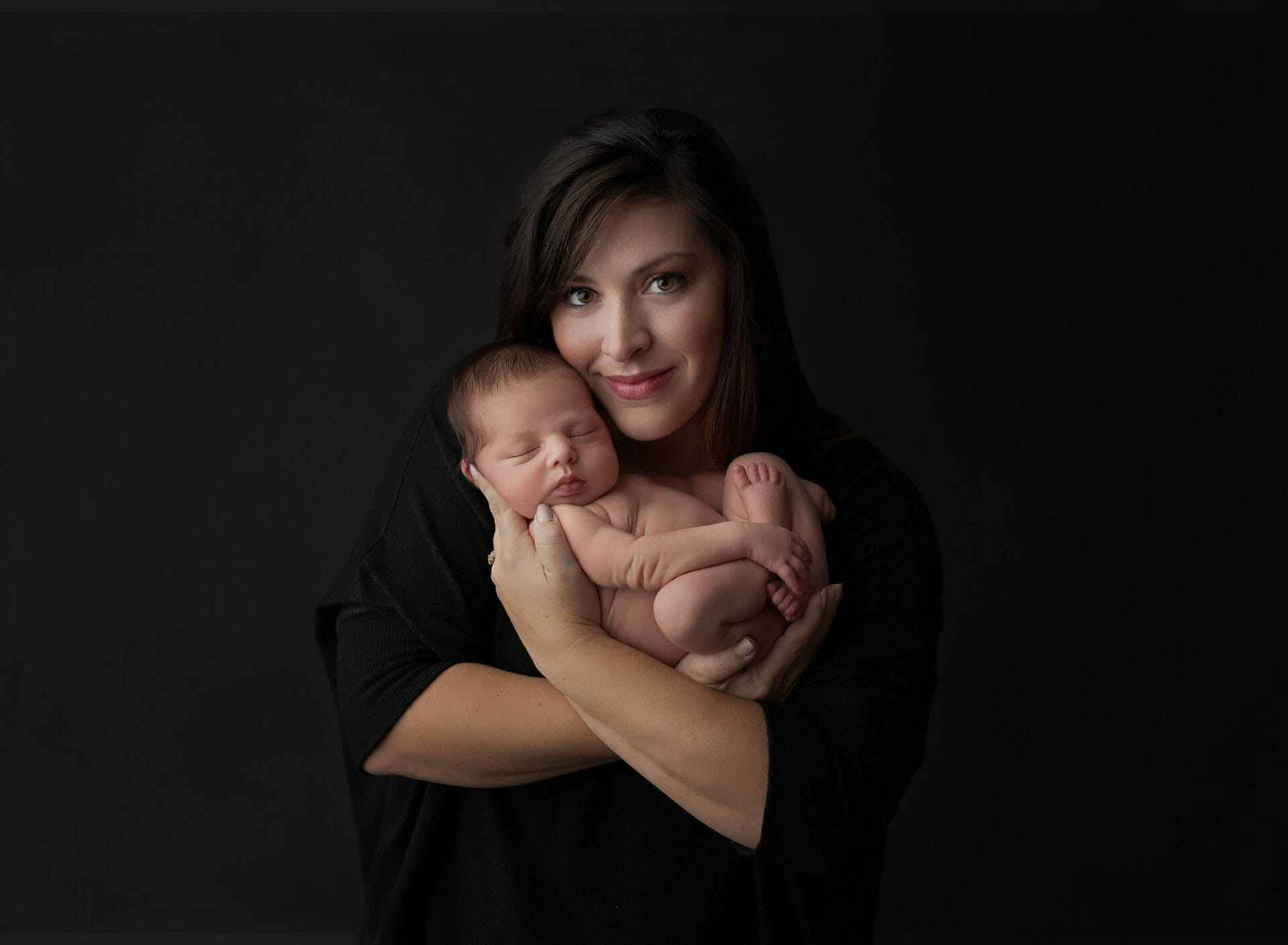 newborn baby boy posed with new mom