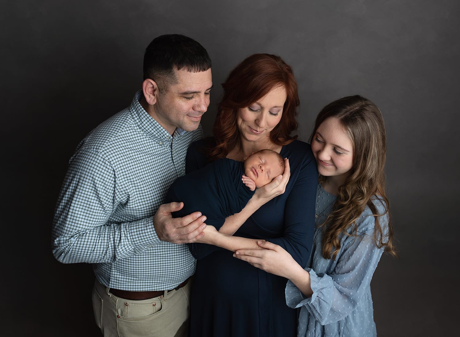 A Lafayette family is in the studio with their baby boy for his newborn photo session.